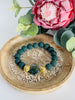 Dark green lava bead bracelet with green Indian Agate gemstone heart. Larger size