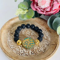 Black lava bead bracelet - 12mm beads with large Indonesian feature bead