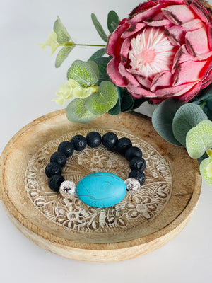 Black lava bead bracelet with extra large turquoise bead